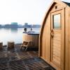 A couple enjoying the hot tub and sauna at CopenHot in Copenhagen